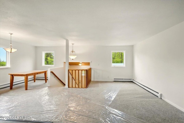 14045 W Willow Fishhook Rd, Willow, AK 99688 - spare room featuring plenty of natural light, baseboard heating, and carpet
