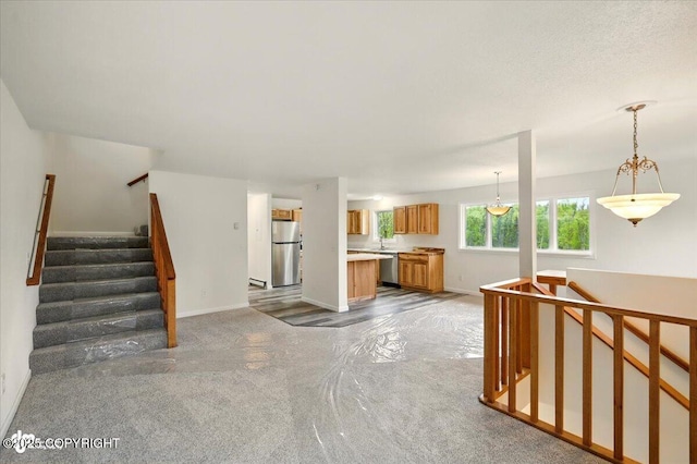 14045 W Willow Fishhook Rd, Willow, AK 99688 - unfurnished living room with carpet floors and baseboards