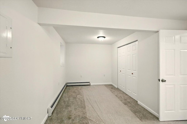 14045 W Willow Fishhook Rd, Willow, AK 99688 - basement featuring baseboard heating, carpet, baseboards, and electric panel
