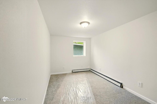 14045 W Willow Fishhook Rd, Willow, AK 99688 - unfurnished room with carpet, baseboard heating, and baseboards