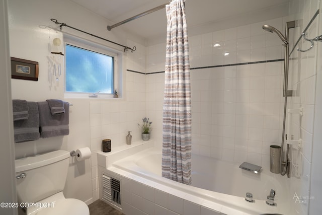 2503 Cedar St, Seward, AK 99664 - bathroom featuring tiled shower / bath combo and toilet