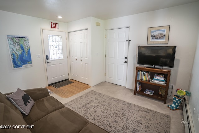 2503 Cedar St, Seward, AK 99664 - living room with light carpet, recessed lighting, and baseboard heating