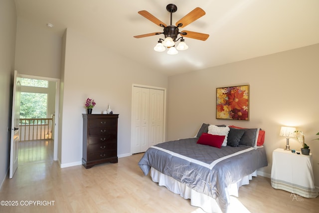 2503 Cedar St, Seward, AK 99664 - bedroom featuring a closet, light wood-style floors, baseboards, high vaulted ceiling, and ceiling fan