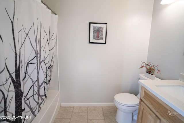 2503 Cedar St, Seward, AK 99664 - full bathroom with vanity, toilet, baseboards, and shower / tub combo