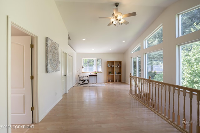 2503 Cedar St, Seward, AK 99664 - corridor featuring light wood-type flooring, baseboards, high vaulted ceiling, and recessed lighting