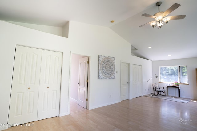 2503 Cedar St, Seward, AK 99664 - unfurnished living room featuring a ceiling fan, wood finished floors, baseboards, high vaulted ceiling, and recessed lighting