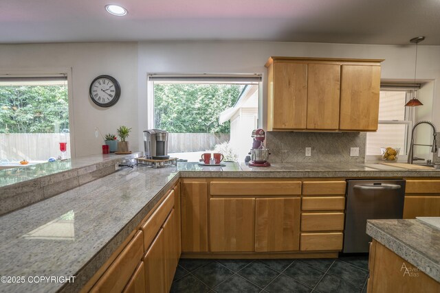 2503 Cedar St, Seward, AK 99664 - kitchen with stainless steel dishwasher, tasteful backsplash, a sink, dark tile patterned floors, and recessed lighting