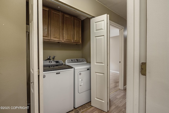 4012 Reka Dr # G5, Anchorage, AK 99508 - laundry area featuring cabinet space, washer and dryer, and light wood-style flooring