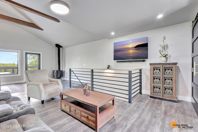 16111 E Nosey Ave, Talkeetna, AK 99676 - living room featuring a wood stove, wood finished floors, recessed lighting, and baseboards