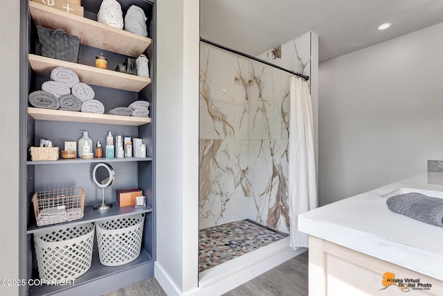 16111 E Nosey Ave, Talkeetna, AK 99676 - bathroom with wood finished floors, a marble finish shower, vanity, and recessed lighting