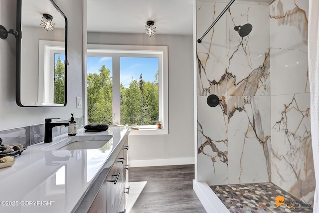 16111 E Nosey Ave, Talkeetna, AK 99676 - bathroom featuring vanity, plenty of natural light, a marble finish shower, and wood finished floors