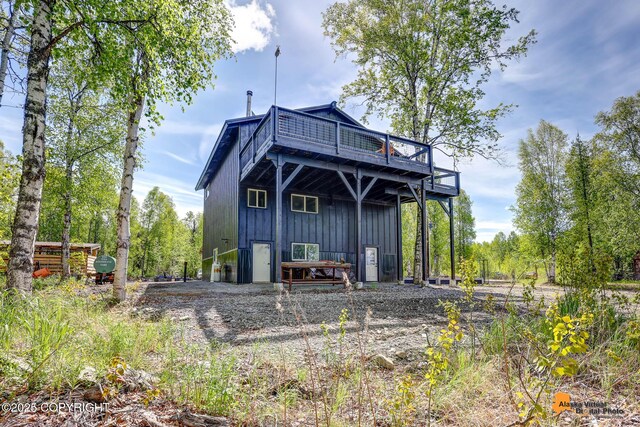 16111 E Nosey Ave, Talkeetna, AK 99676 - back of house with a wooden deck and board and batten siding