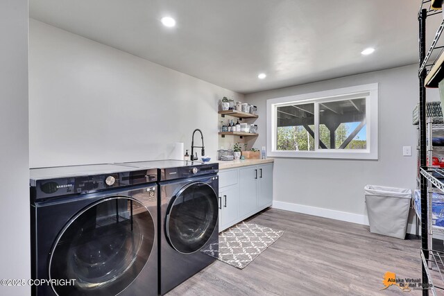 16111 E Nosey Ave, Talkeetna, AK 99676 - washroom featuring washer and dryer, wet bar, wood finished floors, cabinet space, and recessed lighting