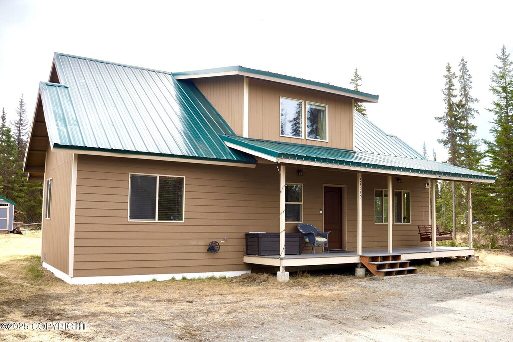 34540 Poppy Wood St, Soldotna, AK 99669 - view of front of house featuring a porch and metal roof