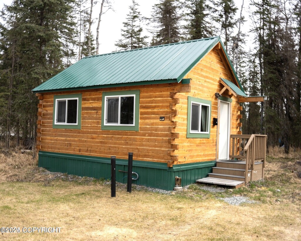 34540 Poppy Wood St, Soldotna, AK 99669 - view of property exterior with log exterior and metal roof