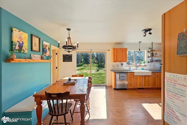 34540 Poppy Wood St, Soldotna, AK 99669 - dining room featuring a chandelier and light wood-style flooring
