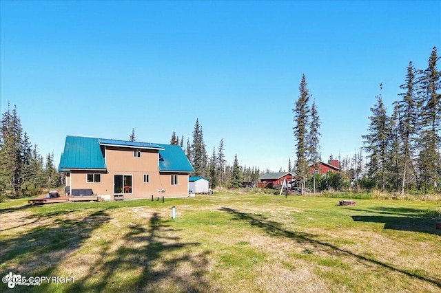 34540 Poppy Wood St, Soldotna, AK 99669 - view of green lawn featuring a deck