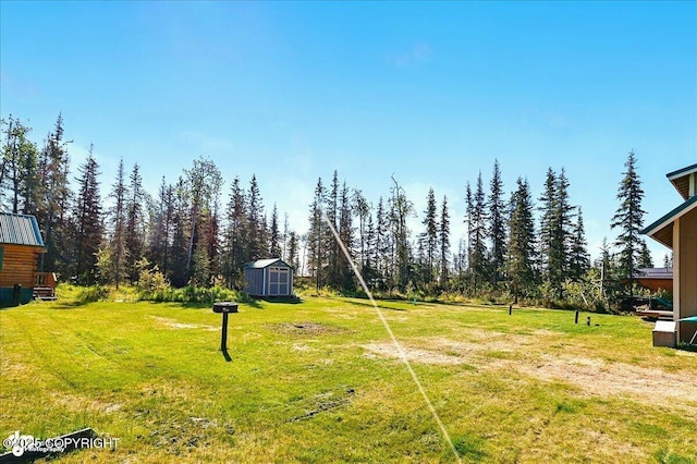 34540 Poppy Wood St, Soldotna, AK 99669 - view of green lawn with a shed