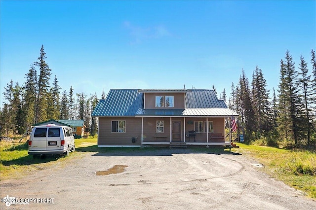 34540 Poppy Wood St, Soldotna, AK 99669 - view of front of home featuring covered porch and a metal roof