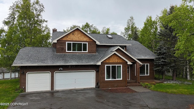 11840 Coughlan Way, Anchorage, AK 99516 - view of front facade with roof with shingles, a chimney, and driveway