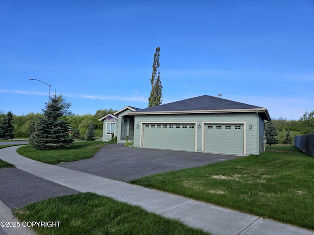 5523 Grand Teton Loop, Anchorage, AK 99502 - ranch-style house featuring asphalt driveway, a front yard, and a garage