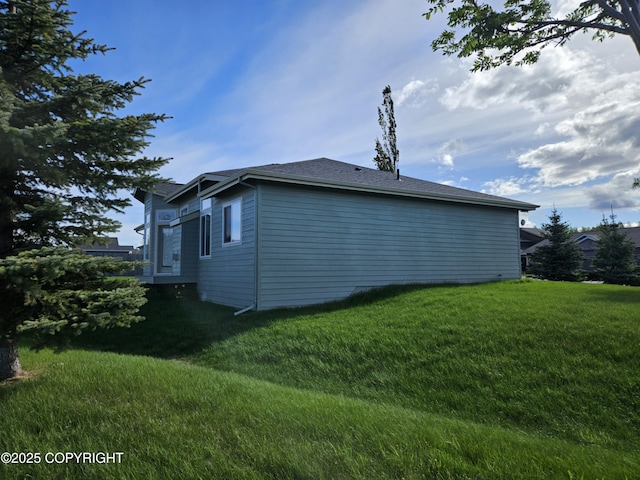 5523 Grand Teton Loop, Anchorage, AK 99502 - view of property exterior with a lawn