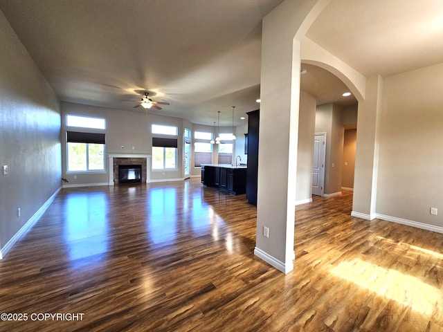 5523 Grand Teton Loop, Anchorage, AK 99502 - unfurnished living room with ceiling fan, dark wood-type flooring, baseboards, a sink, and recessed lighting