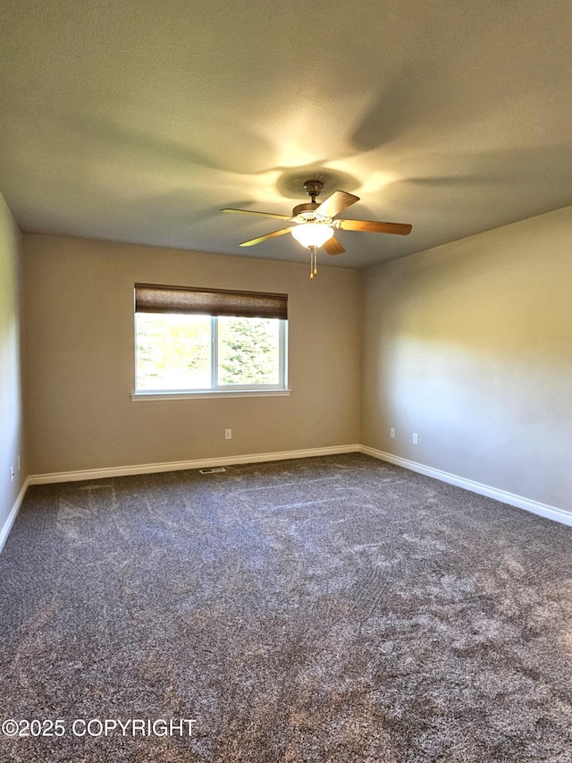 5523 Grand Teton Loop, Anchorage, AK 99502 - unfurnished room featuring carpet floors, ceiling fan, and baseboards
