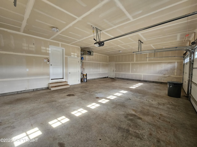 5523 Grand Teton Loop, Anchorage, AK 99502 - garage featuring a garage door opener