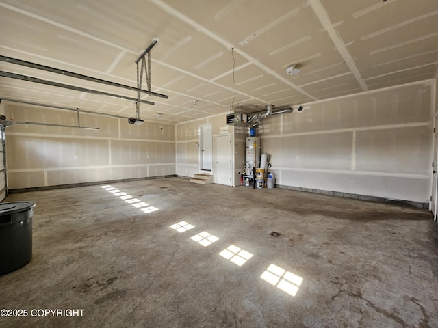 5523 Grand Teton Loop, Anchorage, AK 99502 - garage featuring a garage door opener and strapped water heater