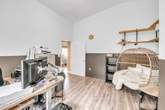 4850 N Riverstone Cir, Palmer, AK 99645 - bedroom featuring a desk, wood finished floors, baseboards, and high vaulted ceiling