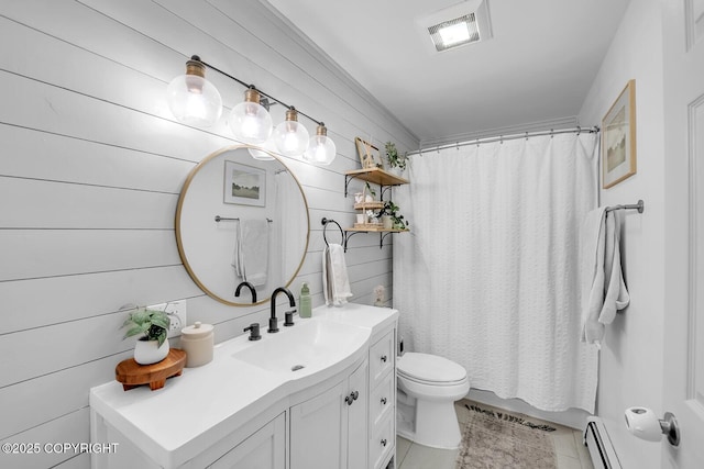 4850 N Riverstone Cir, Palmer, AK 99645 - full bathroom with vanity, a baseboard heating unit, toilet, tile patterned flooring, and wooden walls
