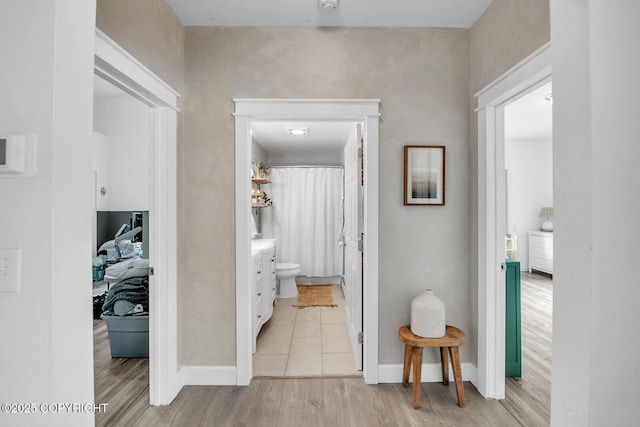 4850 N Riverstone Cir, Palmer, AK 99645 - corridor featuring baseboards and light wood finished floors