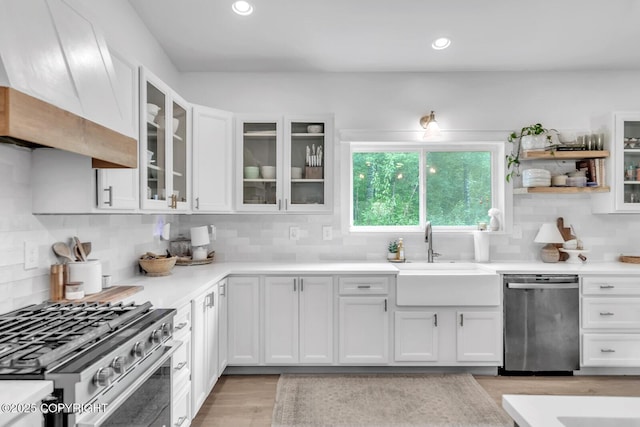 4850 N Riverstone Cir, Palmer, AK 99645 - kitchen featuring appliances with stainless steel finishes, a sink, white cabinets, decorative backsplash, and recessed lighting