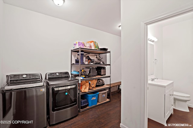 4850 N Riverstone Cir, Palmer, AK 99645 - washroom featuring washing machine and clothes dryer and wood finished floors