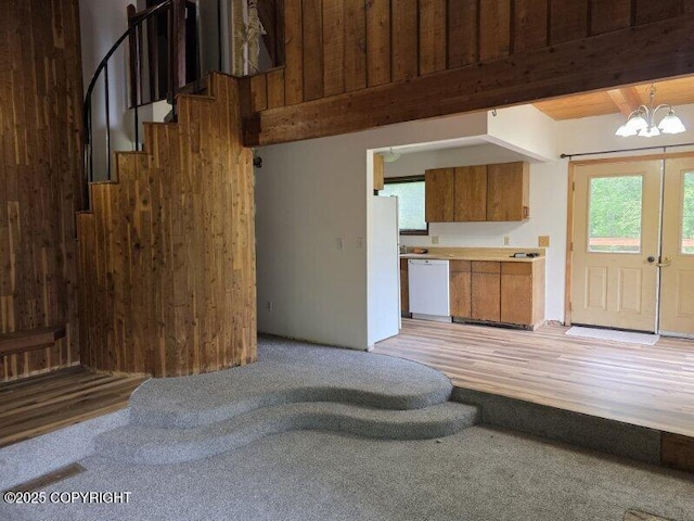 5650 N Talgach View Dr, Wasilla, AK 99654 - living room with a chandelier, wooden walls, stairway, and light wood-type flooring
