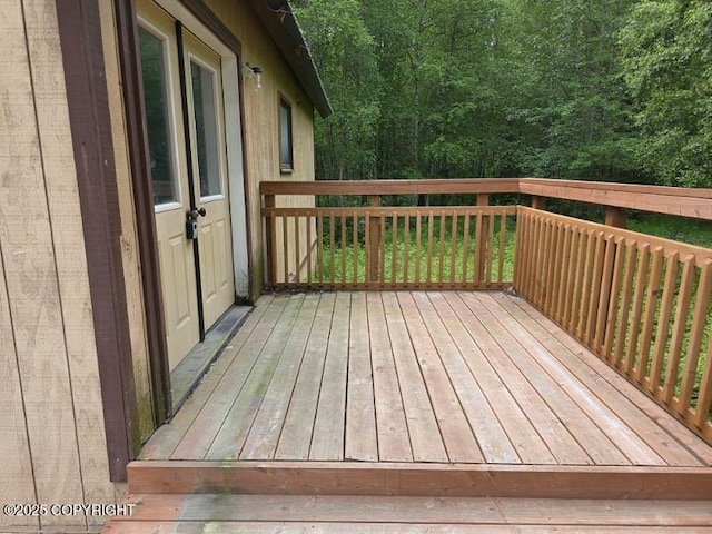 5650 N Talgach View Dr, Wasilla, AK 99654 - wooden terrace with a wooded view