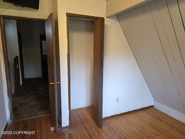 5650 N Talgach View Dr, Wasilla, AK 99654 - unfurnished bedroom featuring hardwood / wood-style flooring and baseboards