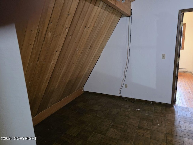 5650 N Talgach View Dr, Wasilla, AK 99654 - empty room featuring wood walls and a baseboard radiator