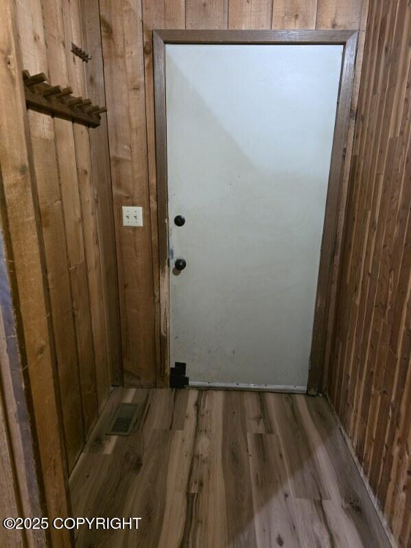 5650 N Talgach View Dr, Wasilla, AK 99654 - doorway to outside with wood finished floors and wooden walls