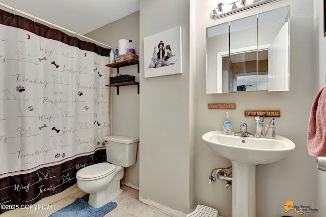 3040 Rosalind Loop, Anchorage, AK 99507 - full bath featuring toilet, a shower with curtain, tile patterned floors, and baseboards