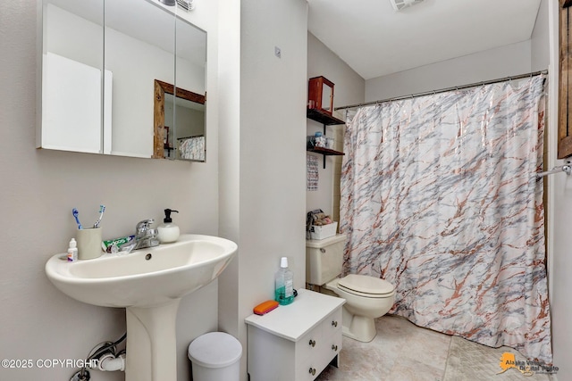 3040 Rosalind Loop, Anchorage, AK 99507 - full bath featuring toilet, a shower with shower curtain, and a sink