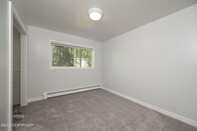 13311 Cove Cir, Anchorage, AK 99515 - unfurnished bedroom featuring a baseboard heating unit and carpet floors
