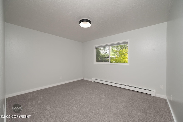 13311 Cove Cir, Anchorage, AK 99515 - spare room with a baseboard radiator, carpet floors, and a textured ceiling
