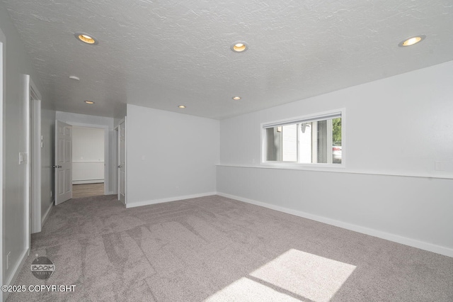 13311 Cove Cir, Anchorage, AK 99515 - empty room featuring carpet floors, recessed lighting, and a textured ceiling