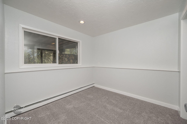 13311 Cove Cir, Anchorage, AK 99515 - empty room with a baseboard heating unit, carpet flooring, recessed lighting, and a textured ceiling