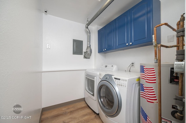 13311 Cove Cir, Anchorage, AK 99515 - washroom featuring electric panel, water heater, cabinet space, light wood finished floors, and separate washer and dryer