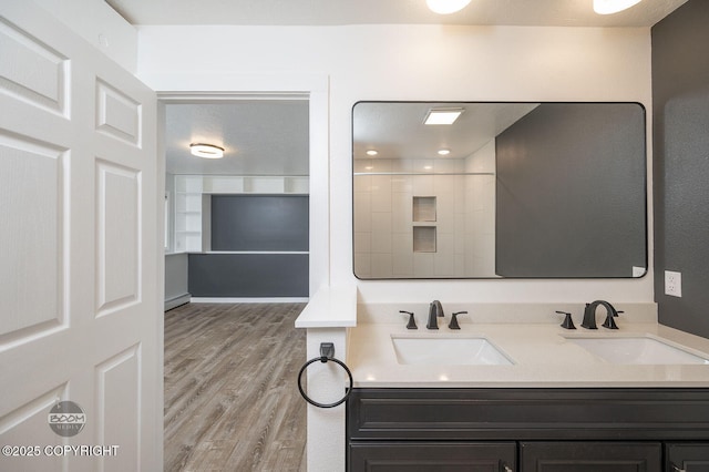 13311 Cove Cir, Anchorage, AK 99515 - bathroom with double vanity and wood finished floors