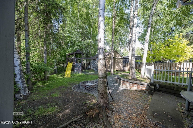 13311 Cove Cir, Anchorage, AK 99515 - view of yard with a playground