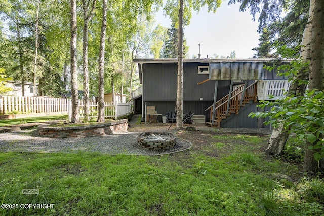 13311 Cove Cir, Anchorage, AK 99515 - rear view of property featuring a fire pit and stairs